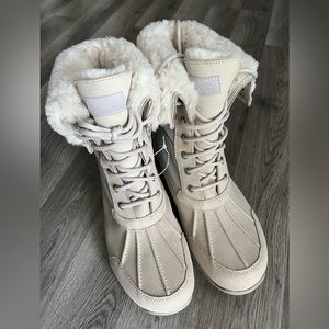 Ugg brand, tan snow boots. New, size 12 in women’s.